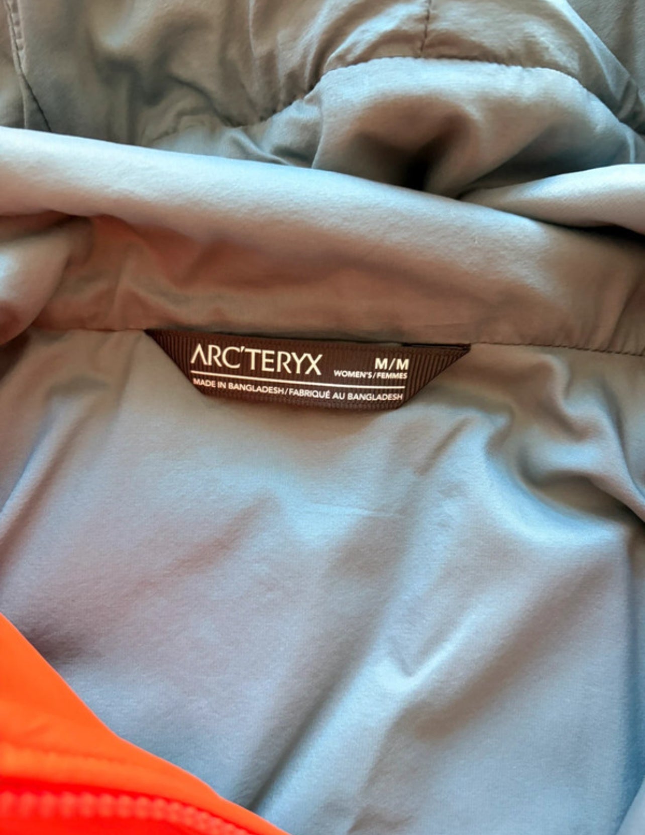Warme Jacke von Arcteryx Proton Hoody (M Damen) orange