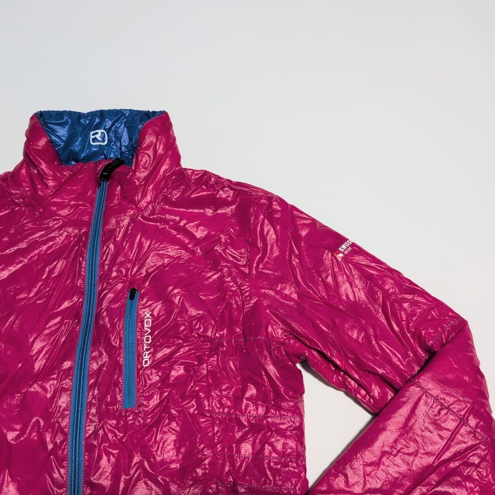 Daunen / Wolle Wende Jacke Ortovox (S Damen) pink blau - wanderlich.com