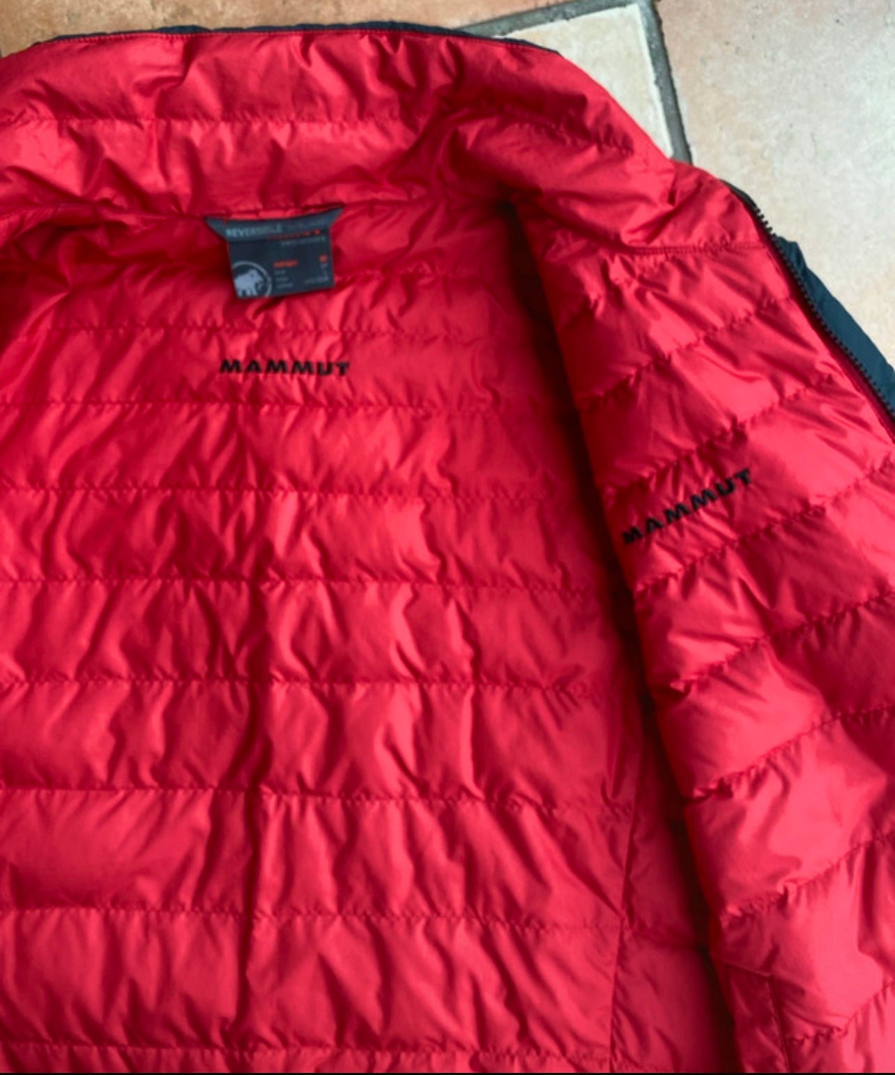 Daunen Wende Jacke von Mammut (M Herren) rot schwarz