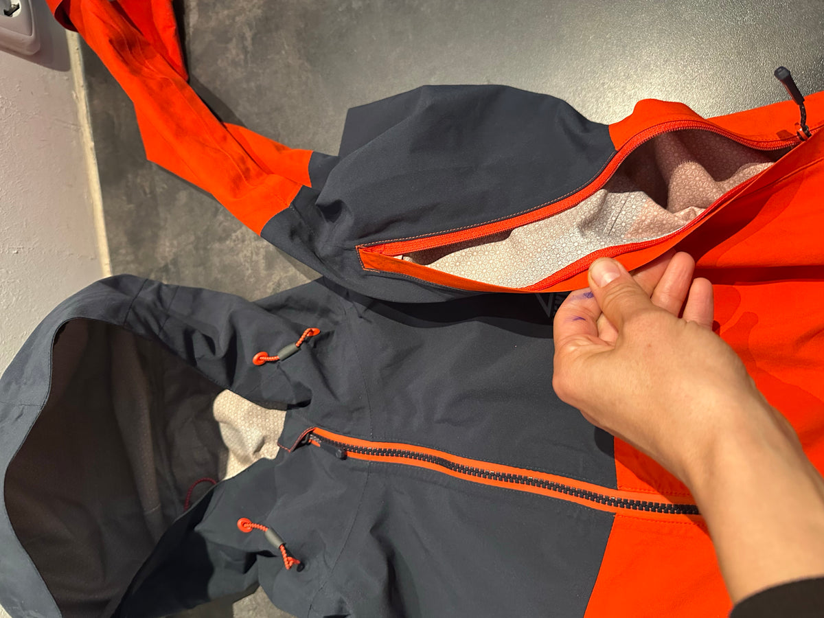 Regen Jacke McKinley (M Herren) orange schwarz