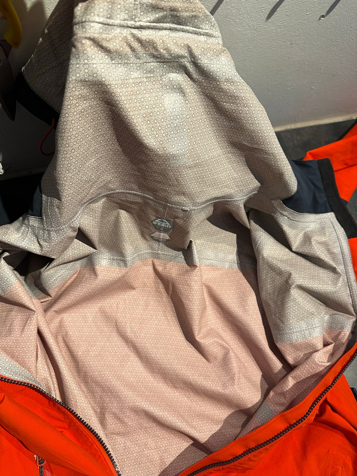 Regen Jacke McKinley (M Herren) orange schwarz