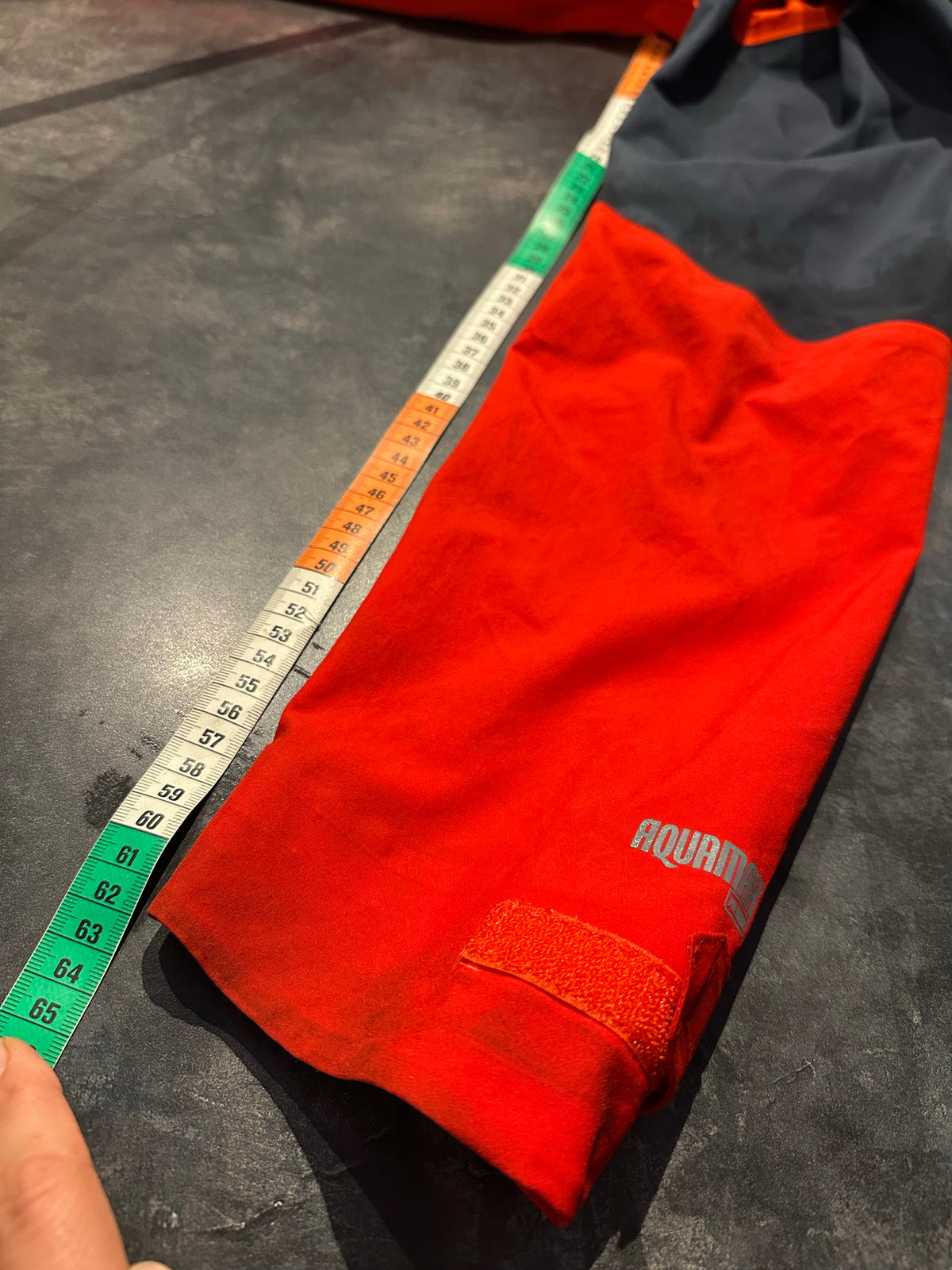 Regen Jacke McKinley (M Herren) orange schwarz